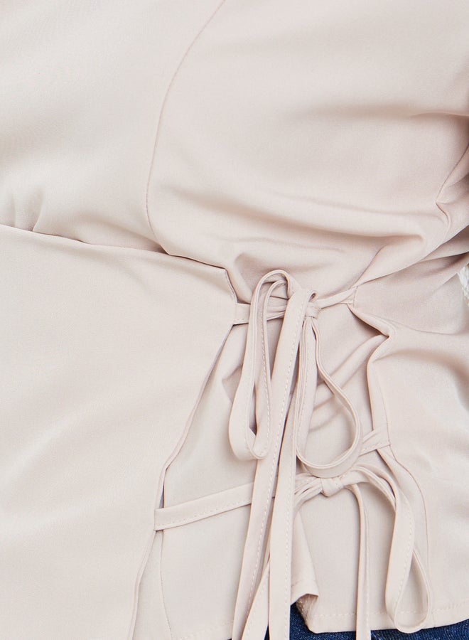 ستايلي بلوزة نسائية بيج بأكمام طويلة ورباط جانبي - Image 2